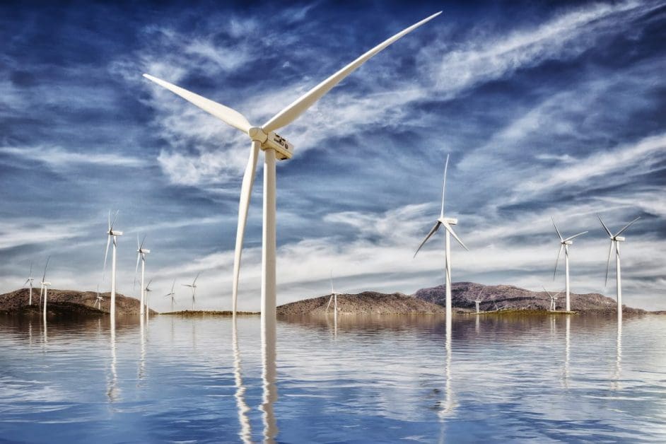 Wind energy farm, lots of wind turbines on a bright blue background.